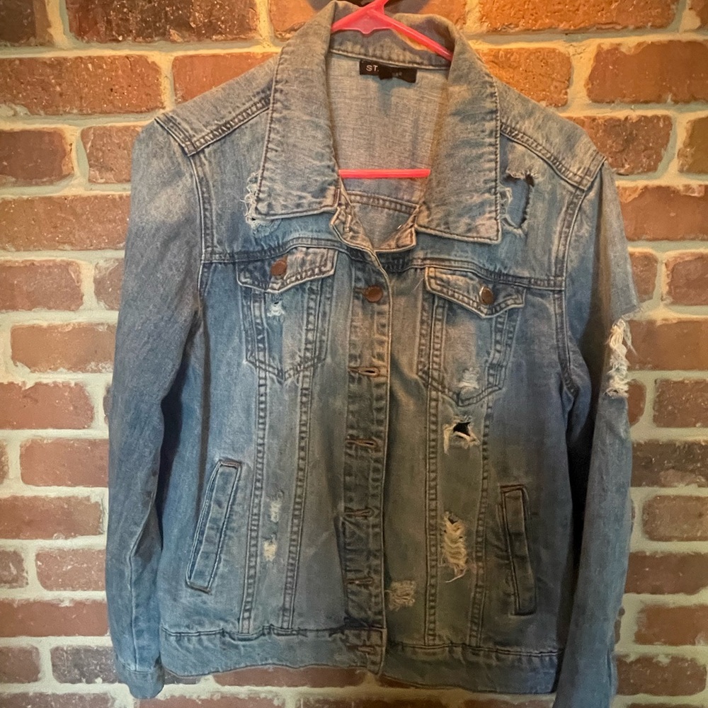 Distressed STS blue Jean jacket with slightly oversized fit.